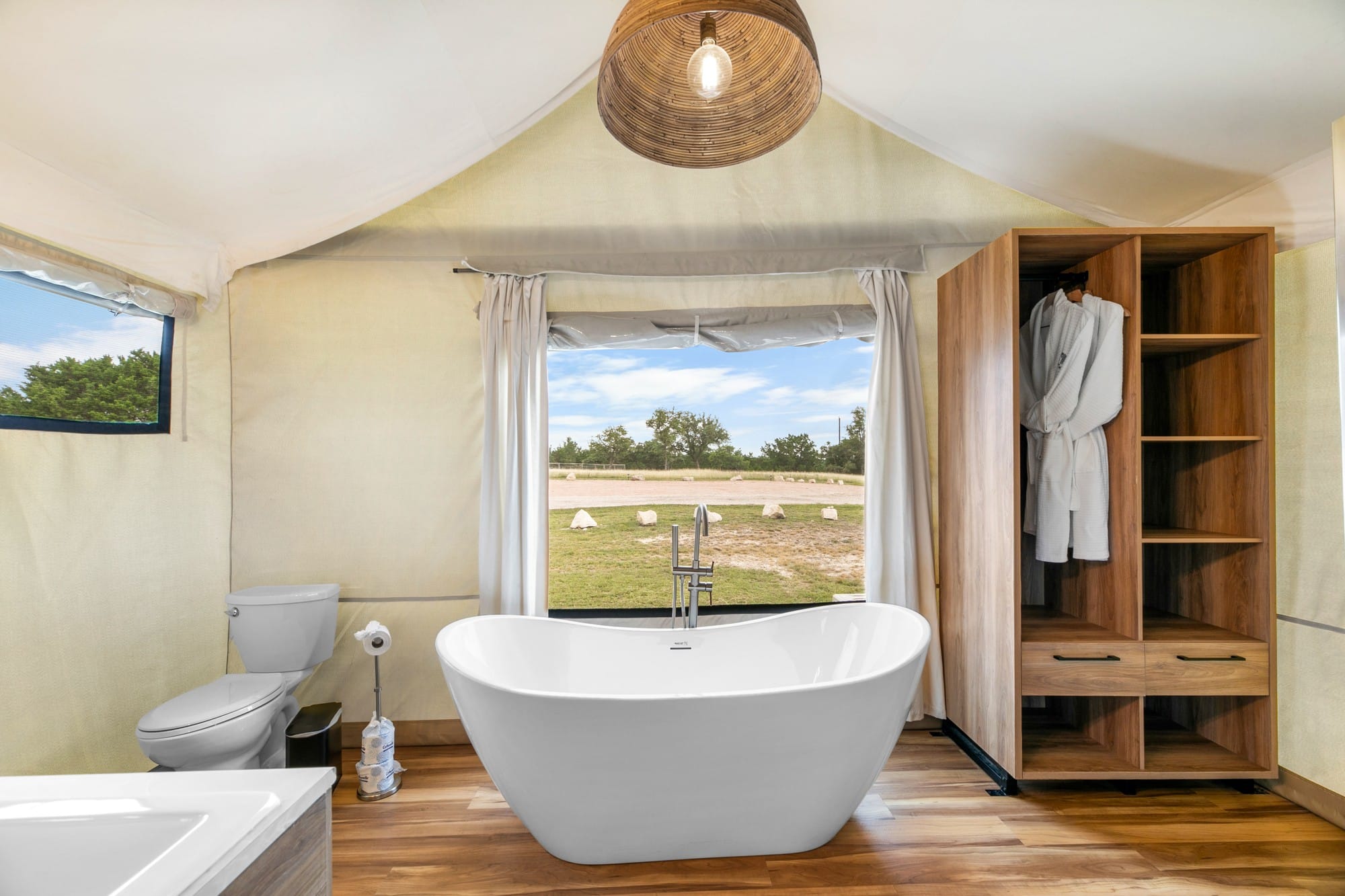 Luxury glamping tent exterior at Camp Hideaway Fredericksburg — Hill Country cabin vacation experience