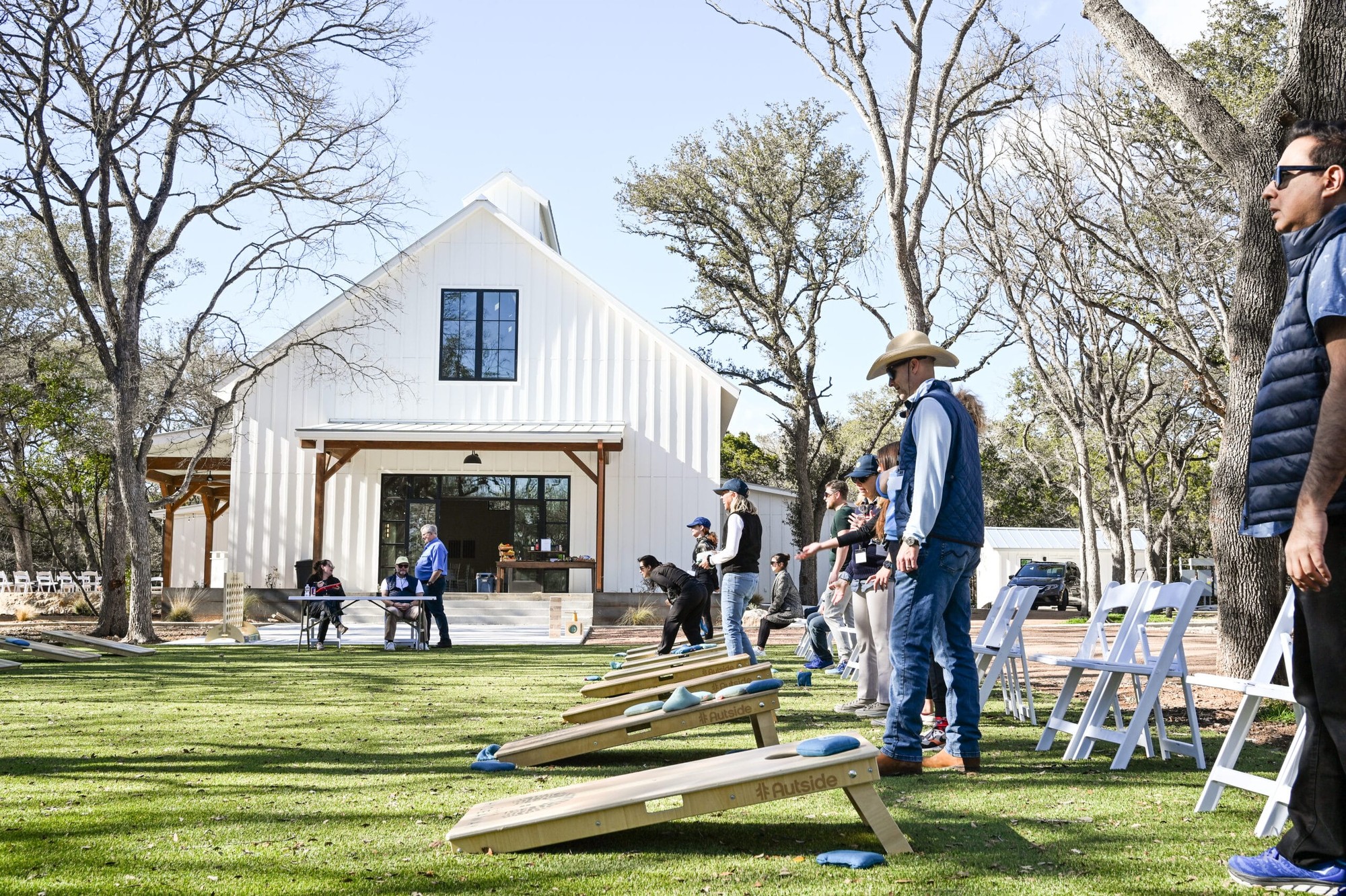 Camp Hideaway Gruene venue lawn and event barn — Texas Hill Country cabin stay near the Guadalupe River